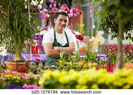 Inmigrante hondureo trabajando en Espaa, jardinero, Garden center. View Large Photo Image Picture - Inmigrante hondureo trabajando en Espaa, jardinero, Garden center.. Fotosearch