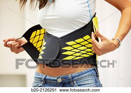 Innovative belt against back pain. View Large Photo Image Stock Image - Innovative belt against back pain.. Fotosearch