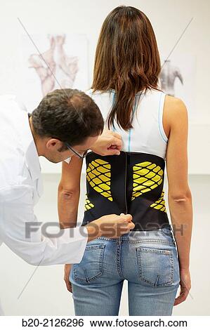 Innovative belt against back pain. View Large Photo Image Stock Photograph - Innovative belt against back pain.. Fotosearch