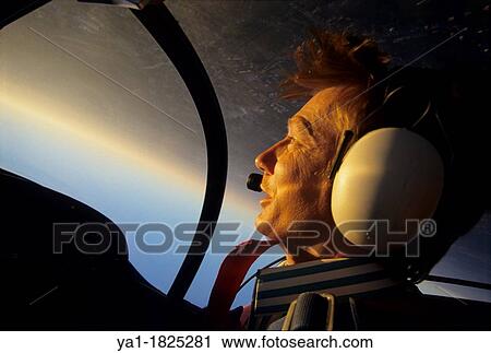 Inside view of a pilot portrait during a looping flight on sunset with a french Cap 10b plane, France View Large Photo Image Stock Image - Inside view of a pilot portrait during a looping flight on sunset with a french Cap 10b plane, France. Fotosearch