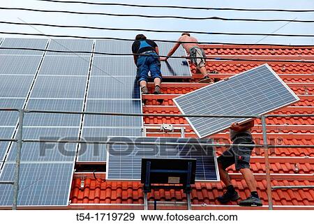 Stock Photo - Installation of a solar plan. Fotosearch
