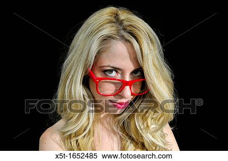 Intelligent blond woman with red glasses on black background View Large Photo Image Stock Photography - Intelligent blond woman with red glasses on black background. Fotosearch