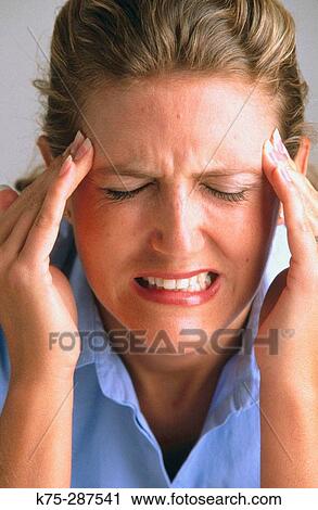 Stock Image - Intense headache. Fotosearch