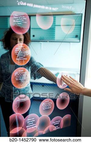 Interactive mirror that allows the person standing in front of it to see a simulated view of how the clothes they wish to buy would look when they wear them without trying the clothes on, Internet of Things lab, Tecnalia Research & Innovation View Large Photo Image Stock Image - Interactive mirror that allows the person standing in front of it to see a simulated view of how the clothes they wish to buy would look when they wear them without trying the clothes on, Internet of Things lab, Tecnalia Research & Innovation. Fotosearch