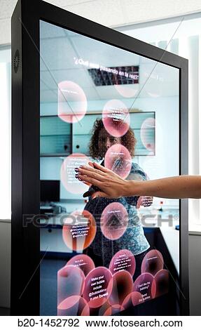 Interactive mirror that allows the person standing in front of it to see a simulated view of how the clothes they wish to buy would look when they wear them without trying the clothes on, Internet of Things lab, Tecnalia Research & Innovation View Large Photo Image Stock Image - Interactive mirror that allows the person standing in front of it to see a simulated view of how the clothes they wish to buy would look when they wear them without trying the clothes on, Internet of Things lab, Tecnalia Research & Innovation. Fotosearch