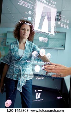 Interactive mirror that allows the person standing in front of it to see a simulated view of how the clothes they wish to buy would look when they wear them without trying the clothes on View Large Photo Image Stock Image - Interactive mirror that allows the person standing in front of it to see a simulated view of how the clothes they wish to buy would look when they wear them without trying the clothes on. Fotosearch