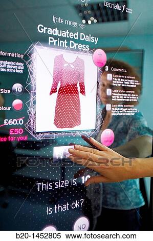 Interactive mirror that allows the person standing in front of it to see a simulated view of how the clothes they wish to buy would look when they wear them without trying the clothes on View Large Photo Image Stock Photography - Interactive mirror that allows the person standing in front of it to see a simulated view of how the clothes they wish to buy would look when they wear them without trying the clothes on. Fotosearch