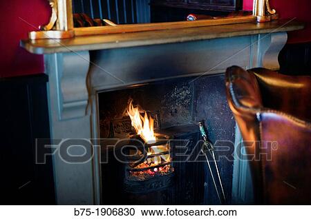 Interior de pub en inglaterra con chimenea encendida, Interior pub with open fire place View Large Photo Image Stock Image - Interior de pub en inglaterra con chimenea encendida, Interior pub with open fire place. Fotosearch