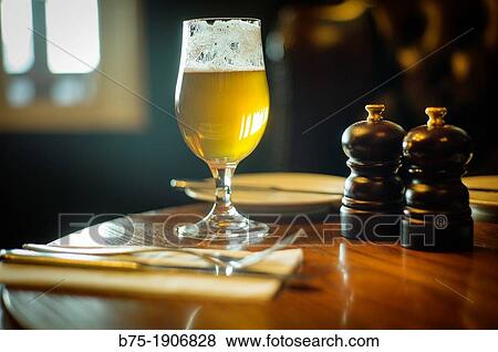 Interior de pub en inglaterra durante lunch time con cerveza en primer plano, Interior of pub in England during lunch time with beer in the foreground View Large Photo Image Stock Photo - Interior de pub en inglaterra durante lunch time con cerveza en primer plano, Interior of pub in England during lunch time with beer in the foreground. Fotosearch