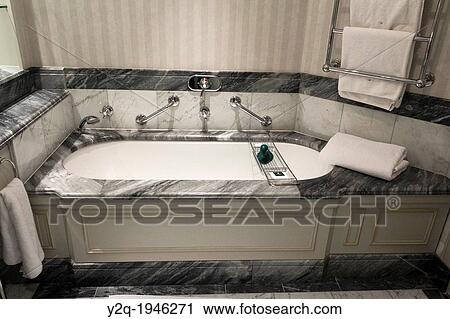 Interior design of a bathroom with a bathtub. View Large Photo Image Stock Image - Interior design of a bathroom with a bathtub.. Fotosearch