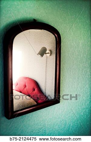 Interior of a room with a mirror reflecting a bed. England, UK, Europe. View Large Photo Image Stock Photography - Interior of a room with a mirror reflecting a bed. England, UK, Europe.. Fotosearch