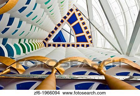 Interior of pillars abstract in the worlds only 7 star hotel the Burj Al Arab in Dubai in UAE where the economy and money is thriving in the United Arab Emirates. View Large Photo Image Picture - Interior of pillars abstract in the worlds only 7 star hotel the Burj Al Arab in Dubai in UAE where the economy and money is thriving in the United Arab Emirates.. Fotosearch