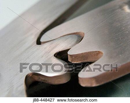 Stock Photo - Interlocking gear teeth. Fotosearch