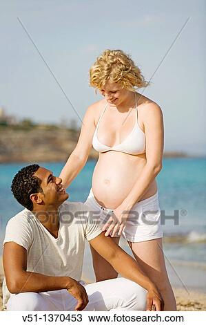 Interracial couple at the beach View Large Photo Image Stock Image - Interracial couple at the beach. Fotosearch