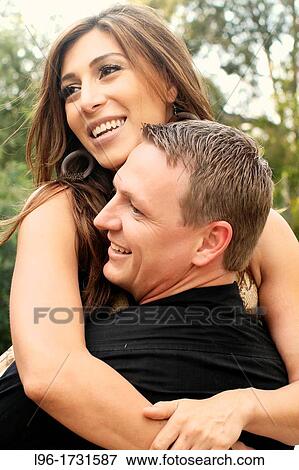 interracial couple embracing View Large Photo Image Stock Photo - interracial couple embracing. Fotosearch