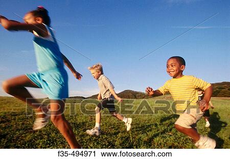 Interracial group of boys and girls run past View Large Photo Image Stock Image - Interracial group of boys and girls run past. Fotosearch