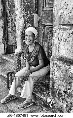 Intersting woman in red local in doorway in central Havana Cuba View Large Photo Image Stock Image - Intersting woman in red local in doorway in central Havana Cuba. Fotosearch