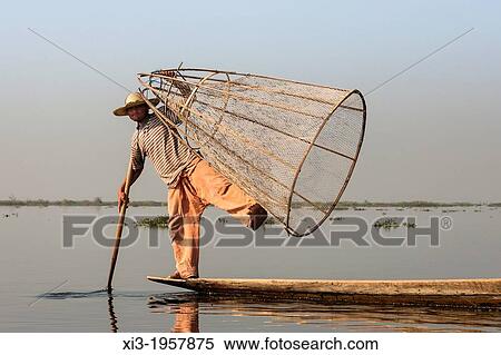 Intha fisherman holding traditional fishing net, Inle Lake, Nyaung Shwe, Shan State, Myanmar, (Burma). View Large Photo Image Stock Photography - Intha fisherman holding traditional fishing net, Inle Lake, Nyaung Shwe, Shan State, Myanmar, (Burma).. Fotosearch