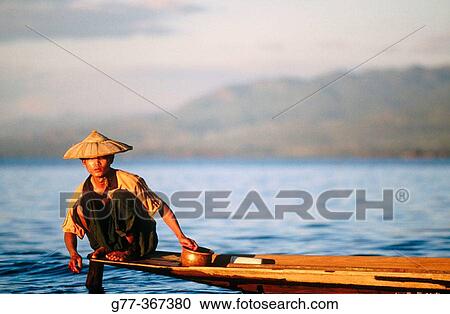 Intha fisherman on Inle Lake. Shan State. Myanmar. View Large Photo Image Stock Image - Intha fisherman on Inle Lake. Shan State. Myanmar.. Fotosearch