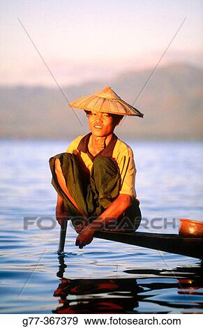 Intha fisherman on Inle Lake. Shan State. Myanmar. View Large Photo Image Stock Photo - Intha fisherman on Inle Lake. Shan State. Myanmar.. Fotosearch