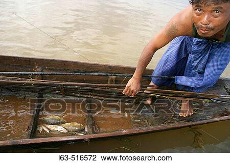 Stock Image - Intha fisherman showing captures on the Inle Lake. Shan state. Myanmar (Burma).. Fotosearch