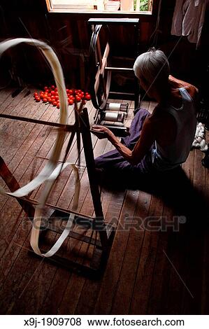 Intha man spinning silk threads at a silk factory, Shan state, Myanmar, Burma View Large Photo Image Stock Photo - Intha man spinning silk threads at a silk factory, Shan state, Myanmar, Burma. Fotosearch