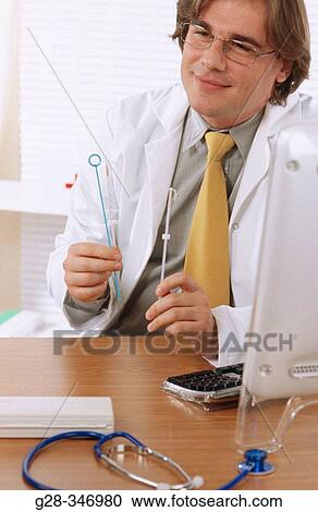 Stock Image - Intra-uterine devices. Fotosearch