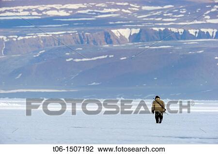 Inuit hunter on icepack, Floe Edge, Arctic Bay, Baffin Island, Nunavut, Canada View Large Photo Image Stock Image - Inuit hunter on icepack, Floe Edge, Arctic Bay, Baffin Island, Nunavut, Canada. Fotosearch