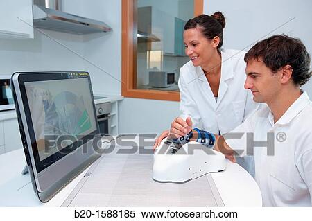 Investigator and patient with assistive robot for upper limb rehabilitation at home View Large Photo Image Stock Photography - Investigator and patient with assistive robot for upper limb rehabilitation at home. Fotosearch