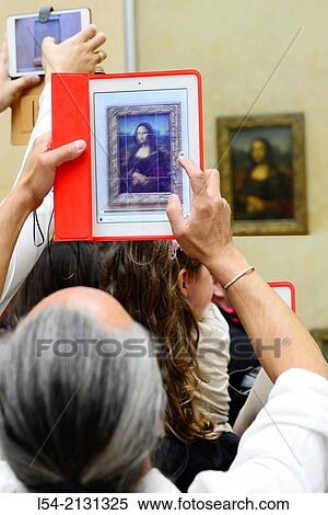 Ipad Mona Lisa Painting The Louvre Museum Paris France Europe FR City of Lights Da Vinci. View Large Photo Image Stock Photography - Ipad Mona Lisa Painting The Louvre Museum Paris France Europe FR City of Lights Da Vinci.. Fotosearch