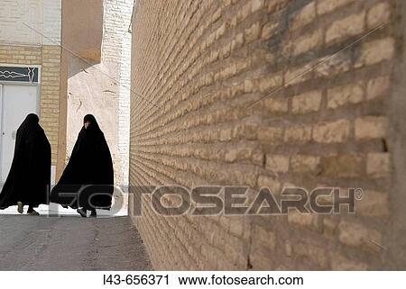 Iranian women dressed in the traditional chador. Yazd. Iran View Large Photo Image Stock Image - Iranian women dressed in the traditional chador. Yazd. Iran. Fotosearch