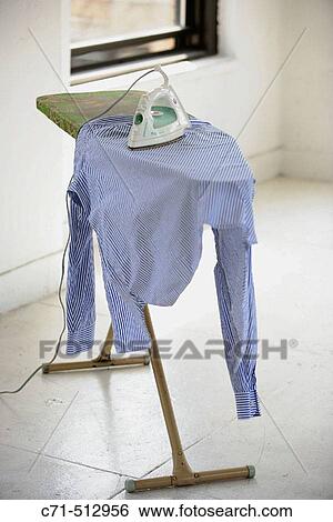 Iron and ironing board. View Large Photo Image Stock Photograph - Iron and ironing board.. Fotosearch
