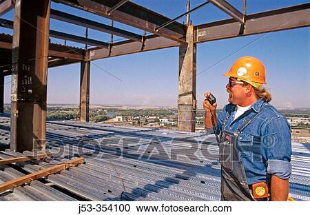 Ironworker crew foreman using radio. Sacramento, California. USA. View Large Photo Image Stock Image - Ironworker crew foreman using radio. Sacramento, California. USA.. Fotosearch