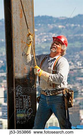 Stock Photograph - Ironworker. Harris State Office Building. Oakland, California. USA.. Fotosearch
