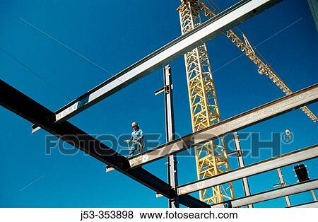 Ironworker walking beam with safety harness. Sacramento. California. View Large Photo Image Stock Photo - Ironworker walking beam with safety harness. Sacramento. California.. Fotosearch