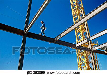 Ironworker walking beam with safety harness. Sacramento. California. View Large Photo Image Stock Photo - Ironworker walking beam with safety harness. Sacramento. California.. Fotosearch