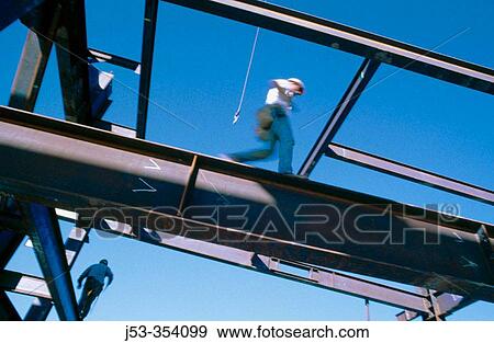 Ironworker walking steel beam, blurred. Sacramento, California. USA. View Large Photo Image Stock Photo - Ironworker walking steel beam, blurred. Sacramento, California. USA.. Fotosearch