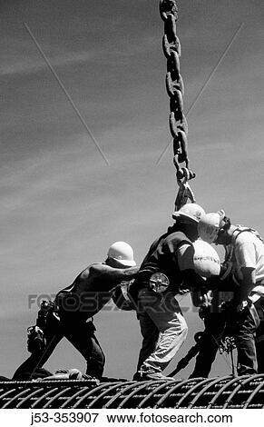 Ironworkers attaching load to crane. I-880 Cypress Project. Oakland, California. USA. View Large Photo Image Stock Photo - Ironworkers attaching load to crane. I-880 Cypress Project. Oakland, California. USA.. Fotosearch