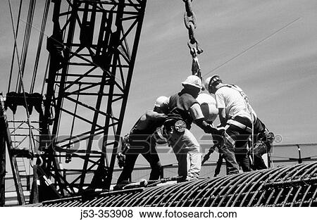 Ironworkers attaching load to crane. I-880 Cypress Project. Oakland, California. USA. View Large Photo Image Stock Photo - Ironworkers attaching load to crane. I-880 Cypress Project. Oakland, California. USA.. Fotosearch