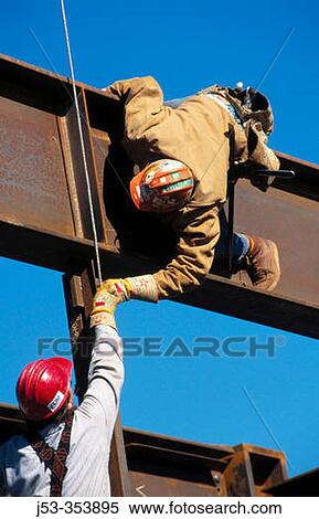Ironworkers connecting beams. Harris State Office Building. Oakland. California. USA. View Large Photo Image Stock Photography - Ironworkers connecting beams. Harris State Office Building. Oakland. California. USA.. Fotosearch