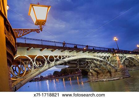 Isabel II bridge or Triana bridge Guadalquivir river Seville, Andalusia, Spain View Large Photo Image Stock Image - Isabel II bridge or Triana bridge Guadalquivir river Seville, Andalusia, Spain. Fotosearch