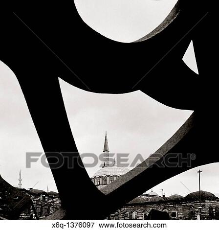 Stock Photo - Islamic minaret contrasts with modern art in Istanbul, Turkey.. Fotosearch