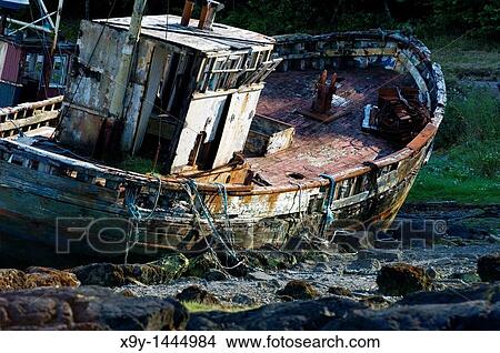 Isle of Mull, Inner Hebrides, Scotland Abandoned inshore fishing boat decaying on the shore at Salen View Large Photo Image Picture - Isle of Mull, Inner Hebrides, Scotland Abandoned inshore fishing boat decaying on the shore at Salen. Fotosearch