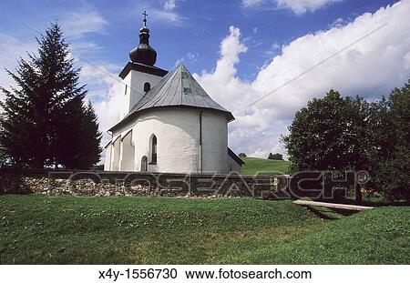 Stock Image - Isolated gothic church dedicated to St John the Baptist, located at the geographical center of Europe, Kremnicke Bane, Slovakia. Fotosearch