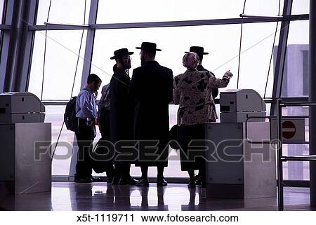 Israel, Ben Gurion Airport, Silhouette of passengers in the departure lounge awaiting their flight View Large Photo Image Stock Image - Israel, Ben Gurion Airport, Silhouette of passengers in the departure lounge awaiting their flight. Fotosearch