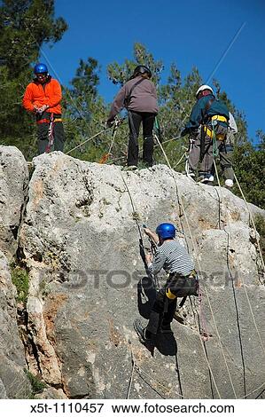 Israel Carmel Mountain A Group Of Mountaineers Rappelling Down A