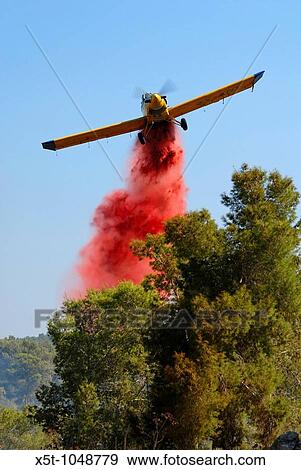 Israel, Fire fighters fighting a forest fire with the aid of a aircraft View Large Photo Image Stock Photo - Israel, Fire fighters fighting a forest fire with the aid of a aircraft. Fotosearch