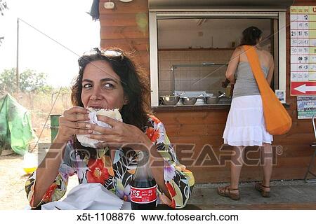 Israel, Galilee, two women at a Falafel stall on the side of the road View Large Photo Image Stock Photograph - Israel, Galilee, two women at a Falafel stall on the side of the road. Fotosearch