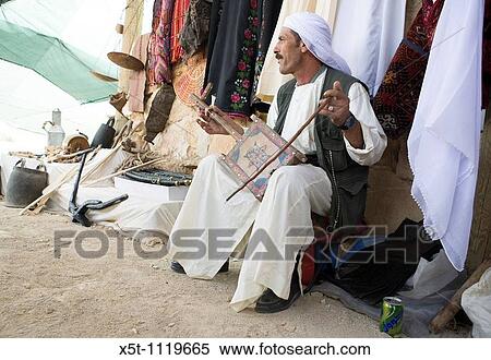 Israel, Negev Desert, Bedouin man playing music on a Rebab View Large Photo Image Stock Photography - Israel, Negev Desert, Bedouin man playing music on a Rebab. Fotosearch