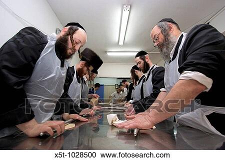 Israel, Tel Aviv, Preparing Matzah In order for the matza to be Kosher strict baking procedures must be followed, All hand made and under a strict watch of the Rabbi April 2005 View Large Photo Image Stock Image - Israel, Tel Aviv, Preparing Matzah In order for the matza to be Kosher strict baking procedures must be followed, All hand made and under a strict watch of the Rabbi April 2005. Fotosearch